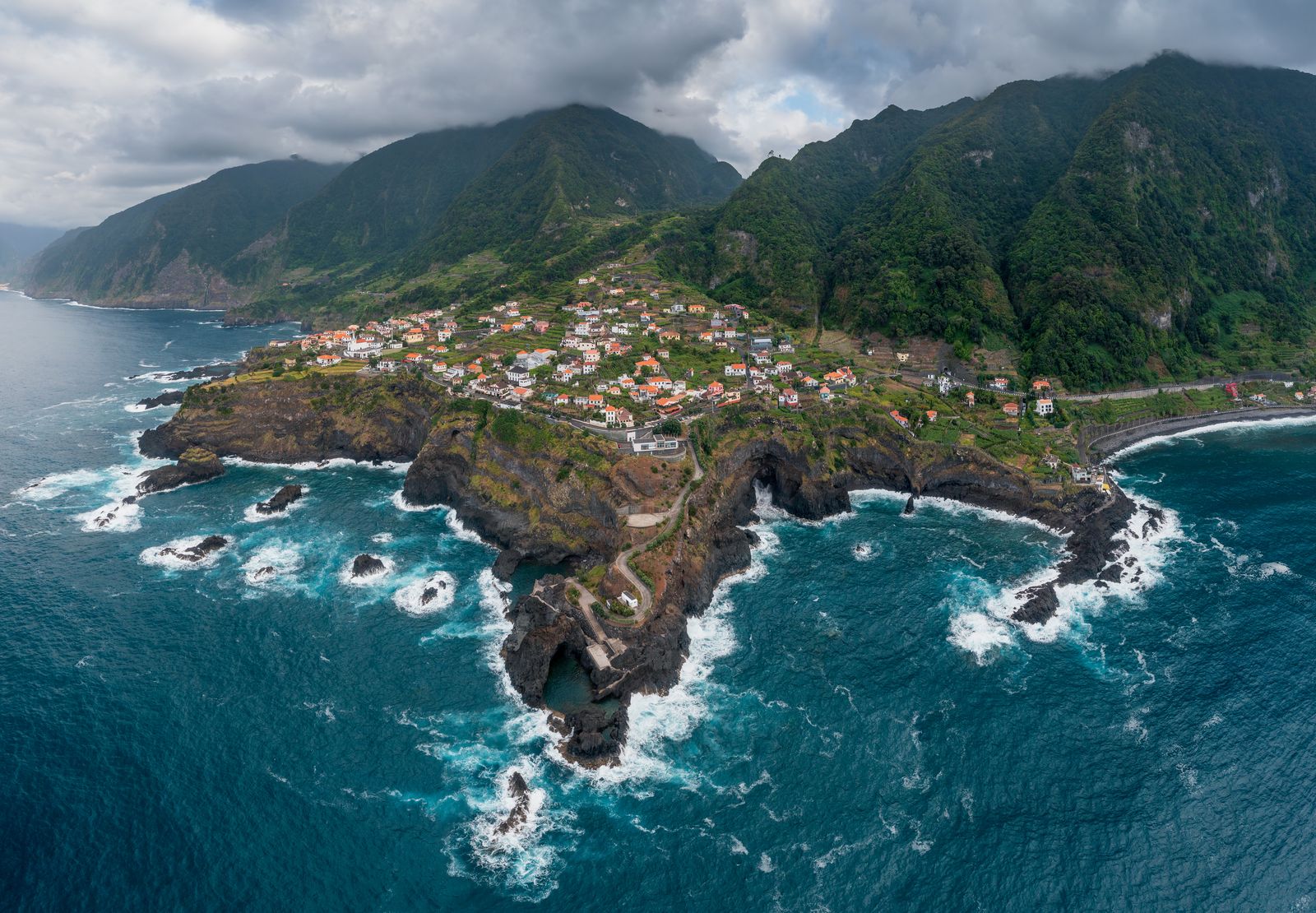 Green cliffs falling to the Atlantic at Seixal, on Madeira's wild north coast